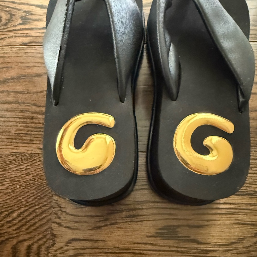 Cult Gaia Black and Gold Sandals
